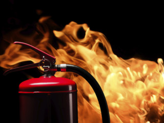 fire-extinguisher on flame background